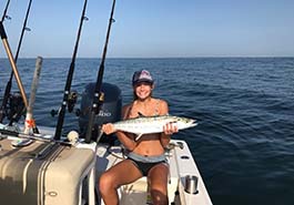 Girl Posing with Her Catch
